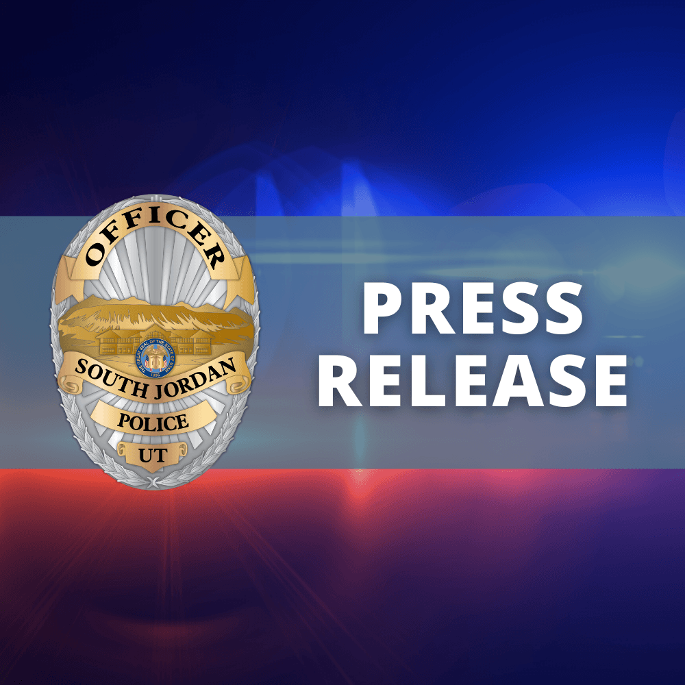 It says press release with a police badge and flashing lights in background