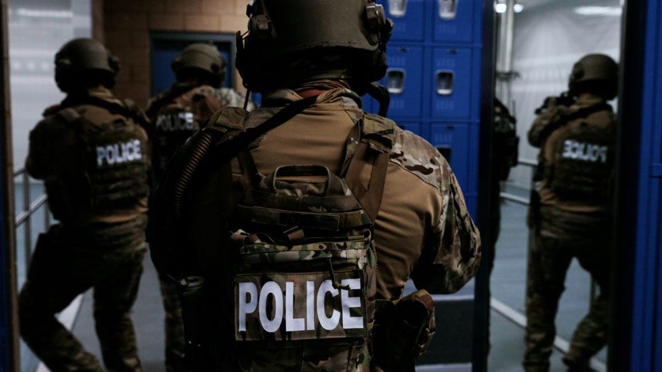 swat team clearing a school locker room